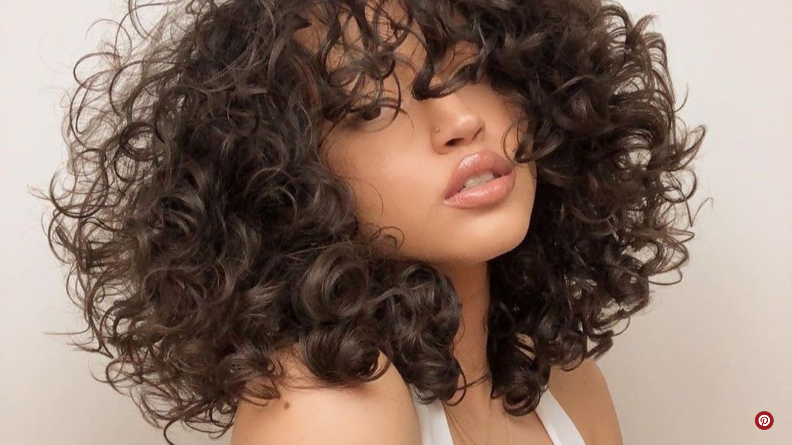 Curly Collarbone Cut